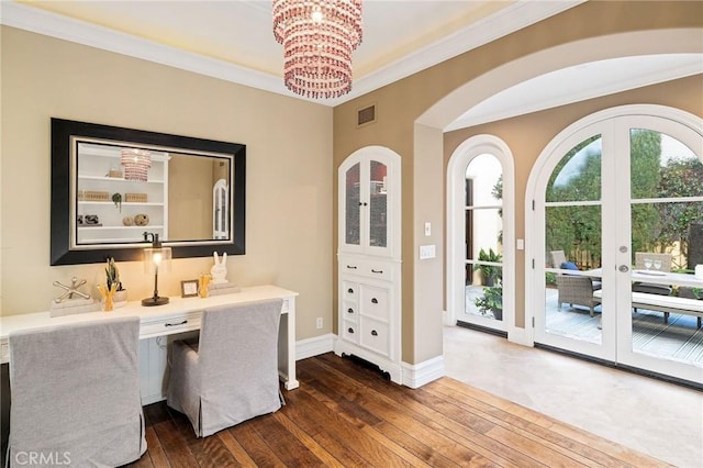 office with crown molding, a chandelier, visible vents, and dark wood finished floors