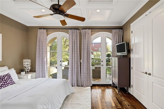 bedroom featuring access to exterior, multiple windows, ornamental molding, and french doors