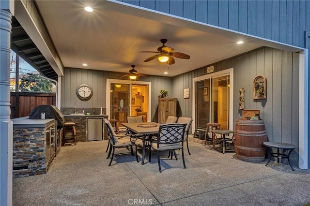 view of patio / terrace featuring outdoor dining area, ceiling fan, area for grilling, and fence