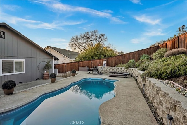 view of pool with a fenced backyard, a fenced in pool, and a patio