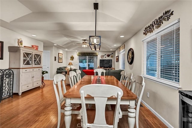 dining space featuring a ceiling fan, a wealth of natural light, and wood finished floors