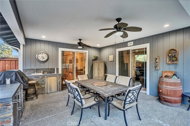 view of patio / terrace featuring outdoor dining space and a ceiling fan