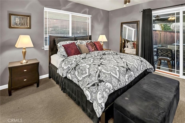 bedroom with carpet floors, access to exterior, and baseboards