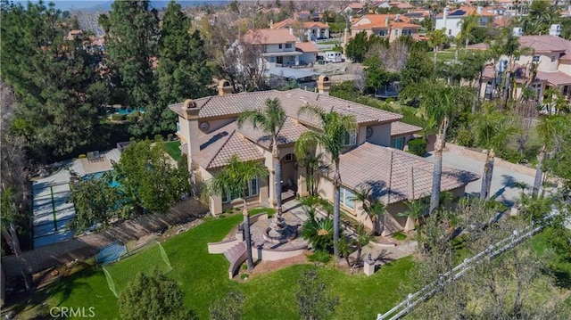 birds eye view of property with a residential view