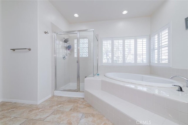 full bathroom featuring a stall shower, a garden tub, baseboards, and recessed lighting