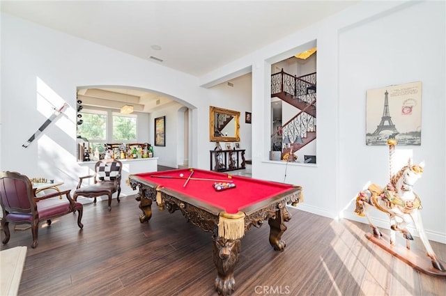 rec room with billiards, baseboards, visible vents, arched walkways, and wood finished floors