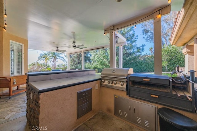 view of patio / terrace featuring ceiling fan, grilling area, and area for grilling