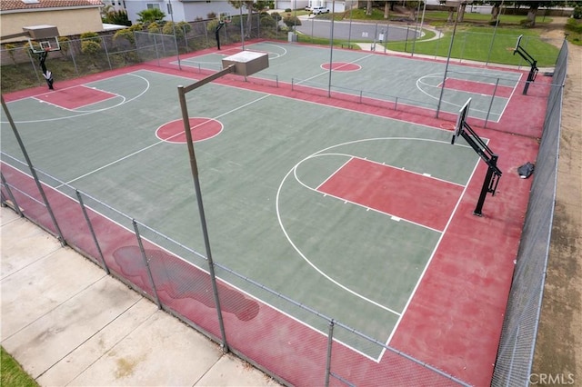 view of basketball court featuring community basketball court and fence