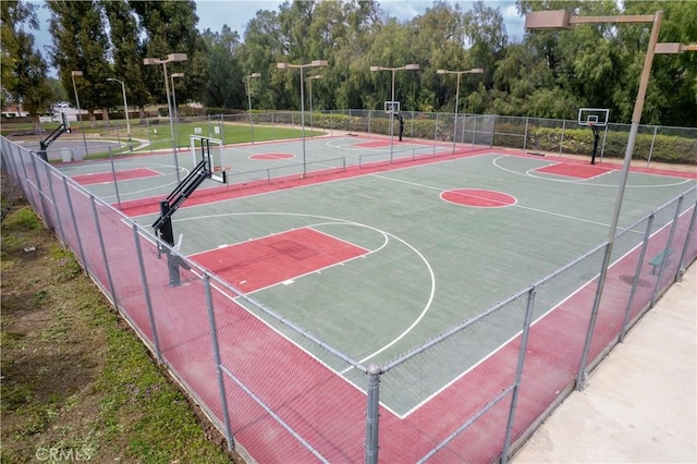 view of sport court with community basketball court and fence