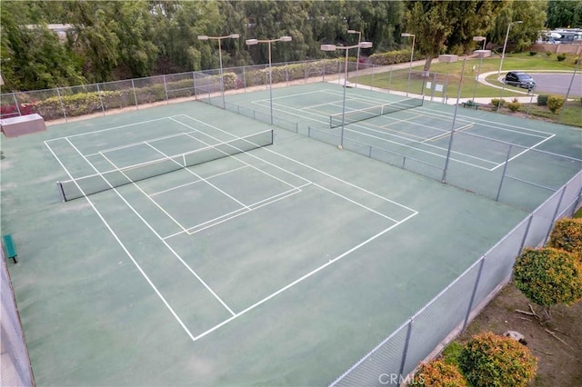 view of tennis court with fence