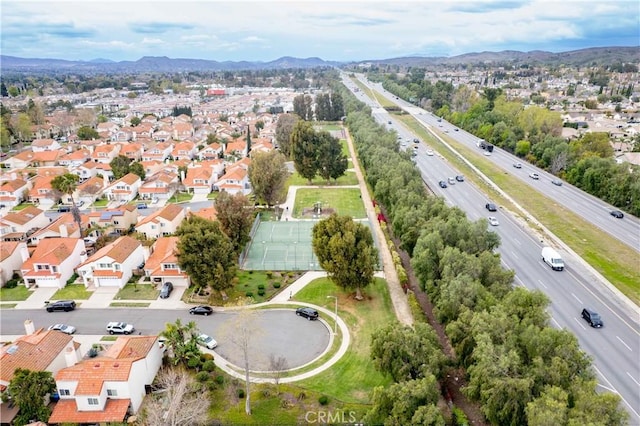 drone / aerial view with a residential view and a mountain view