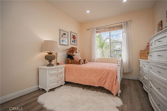 bedroom featuring baseboards, dark wood finished floors, and recessed lighting