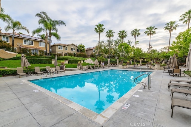 pool featuring a patio and fence