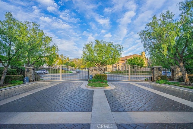 view of property's community with a gate