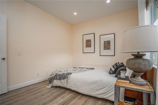 bedroom featuring recessed lighting, baseboards, and wood finished floors