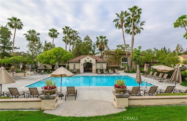 pool featuring a patio area and fence