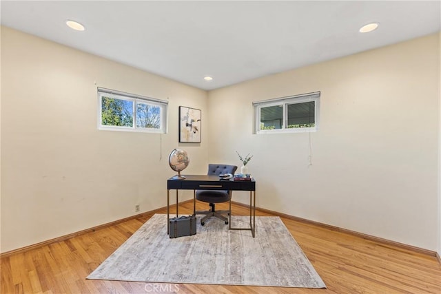 home office with baseboards, wood finished floors, and recessed lighting