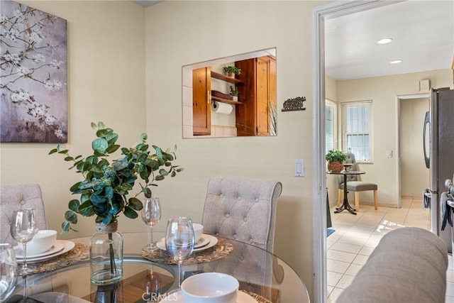 dining area with recessed lighting and light tile patterned floors