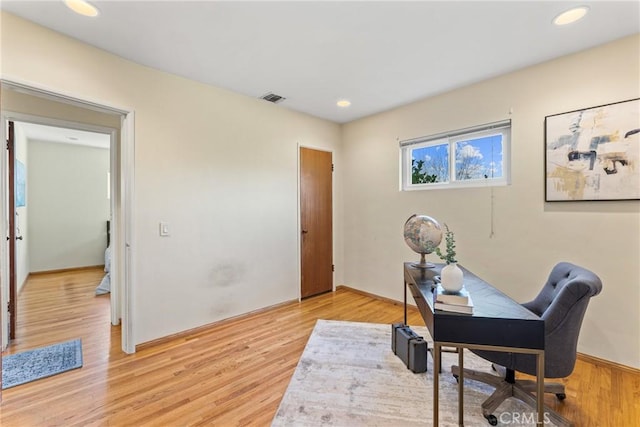 office space with light wood finished floors, visible vents, and recessed lighting