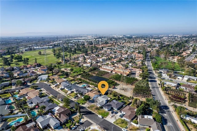 birds eye view of property with a residential view