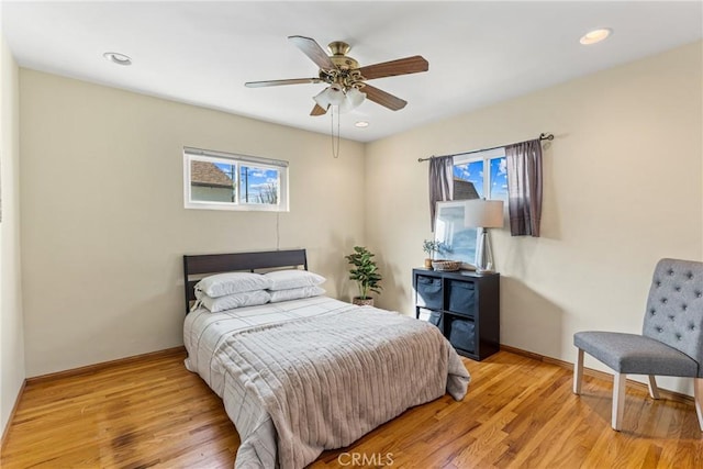 bedroom featuring recessed lighting, light wood-style flooring, and baseboards