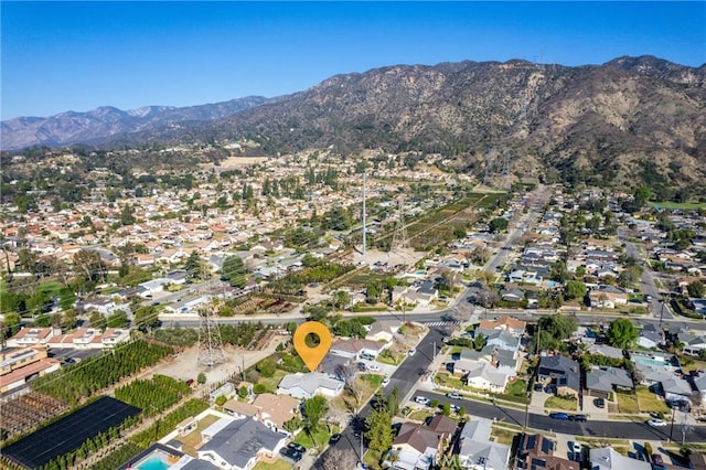 drone / aerial view with a residential view and a mountain view