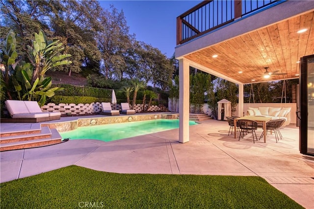 view of pool with a patio, an outbuilding, a fenced backyard, and a fenced in pool