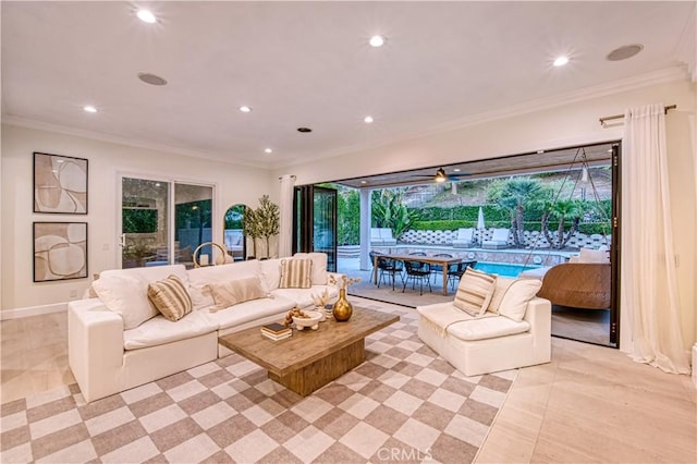 living room with baseboards, ornamental molding, and recessed lighting