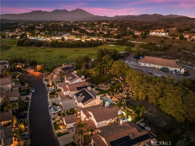 birds eye view of property featuring a mountain view