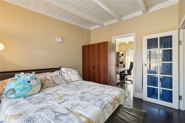 bedroom featuring dark wood-style floors, wooden ceiling, and beam ceiling