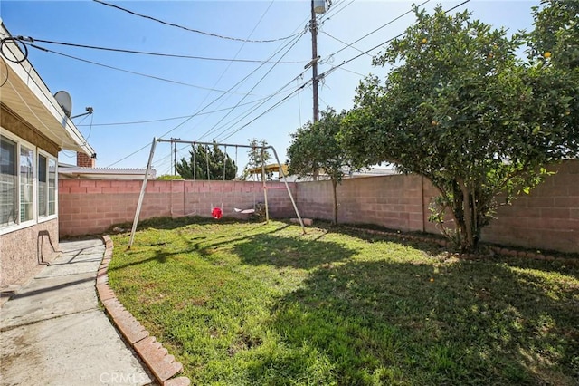 view of yard with a fenced backyard