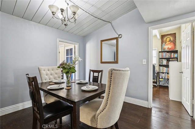 dining space with baseboards, dark wood-type flooring, wood ceiling, and an inviting chandelier