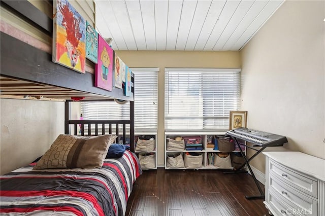 bedroom with dark wood finished floors and wood ceiling