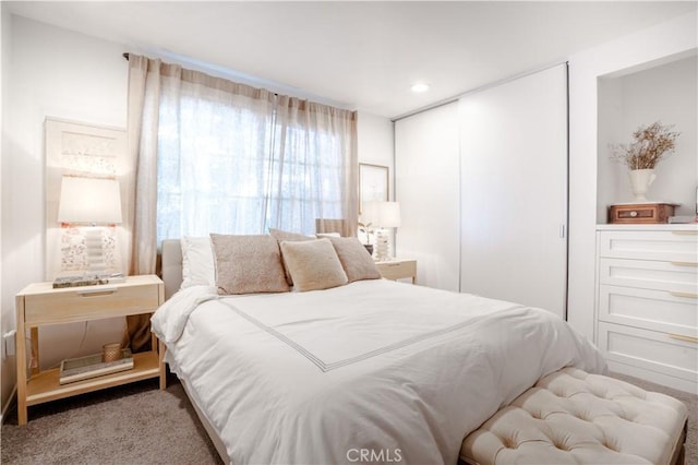 bedroom with carpet floors and recessed lighting