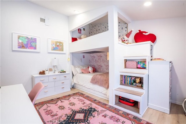 bedroom featuring light wood finished floors