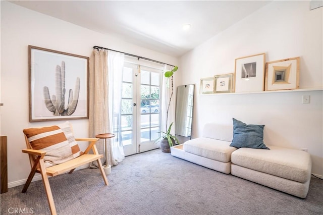 sitting room with carpet, french doors, vaulted ceiling, and baseboards