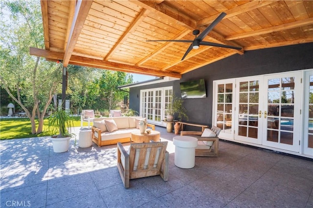 view of patio with ceiling fan, outdoor lounge area, and french doors