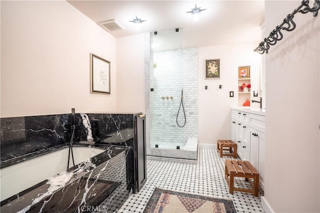 full bathroom featuring a garden tub, visible vents, vanity, baseboards, and a tile shower