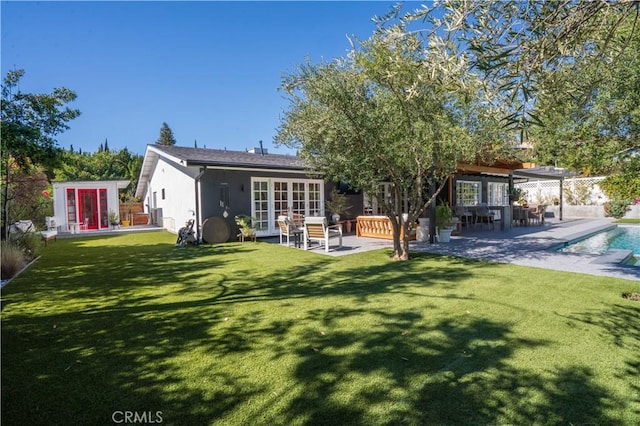 5910 Pat Ave, Woodland Hills, CA 91367 - back of house with french doors, a patio area, an outdoor pool, and stucco siding