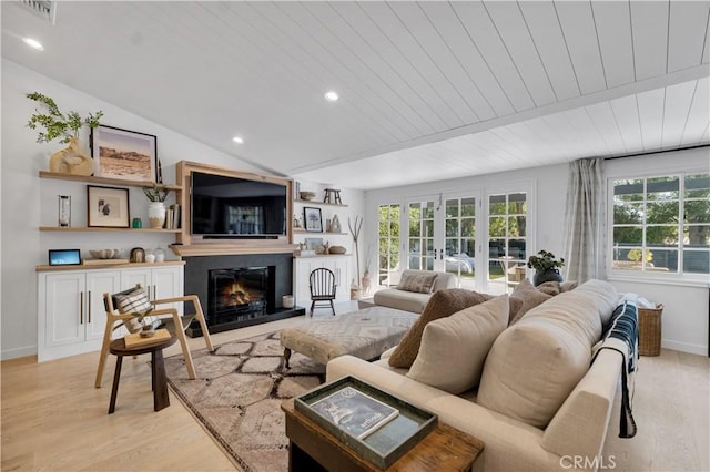5910 Pat Ave, Woodland Hills, CA 91367 - living area featuring light wood-style flooring, plenty of natural light, a glass covered fireplace, wood ceiling, and baseboards