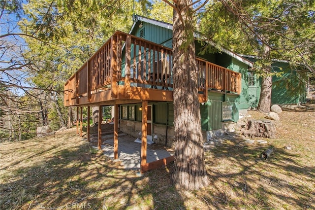 exterior space featuring a wooden deck