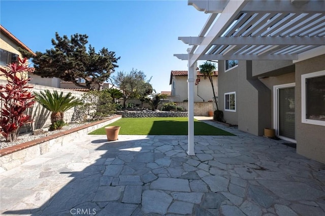 view of patio / terrace with a fenced backyard and a pergola