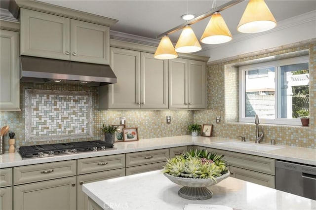 kitchen with appliances with stainless steel finishes, ornamental molding, range hood, pendant lighting, and a sink