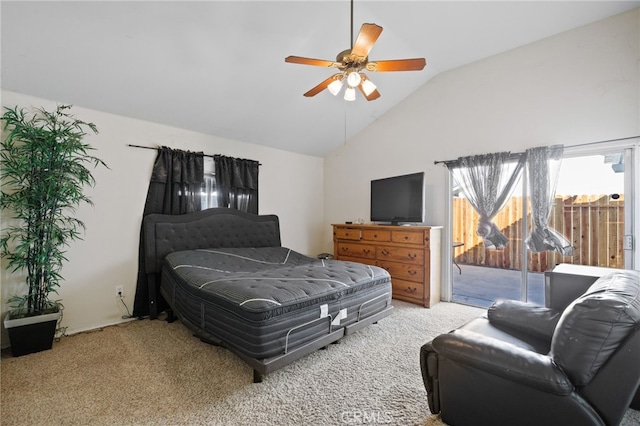 carpeted bedroom with vaulted ceiling, access to outside, and ceiling fan