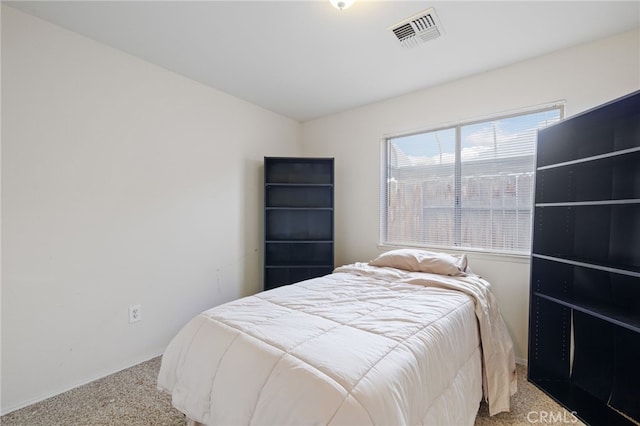 bedroom with light carpet, baseboards, and visible vents