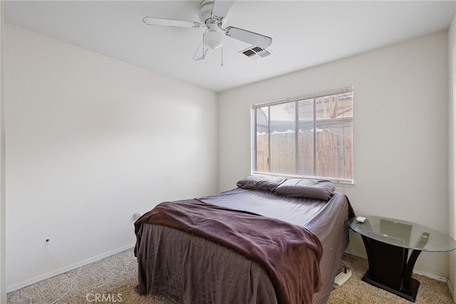 bedroom with baseboards, ceiling fan, visible vents, and light colored carpet