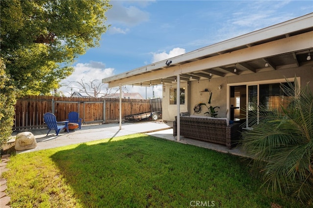 view of yard featuring a patio area and fence