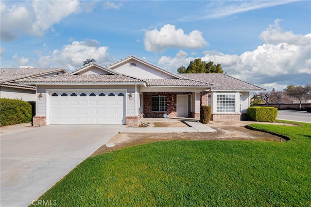 single story home with a front yard, brick siding, driveway, and an attached garage