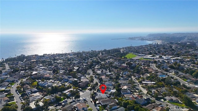 drone / aerial view featuring a water view and a residential view