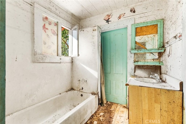 bathroom with wood ceiling, vanity, and a bath